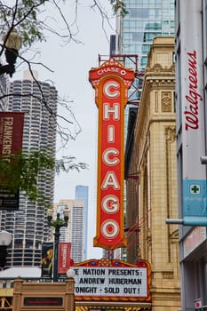 Image of Large orange and yellow Chicago sign with white lettering above a theatre