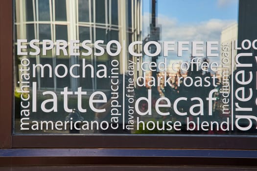 Modern Coffee Shop Menu Window in Bustling Downtown Muncie, Indiana, 2023