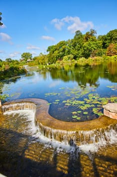 Sunlit Waterfall in Botanic Garden, Elkhart, Indiana - A Tranquil Oasis Transitioning from Summer to Autumn