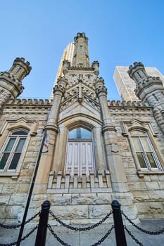 Image of Tourism chains around Chicago water tower entrance to historic original castle building