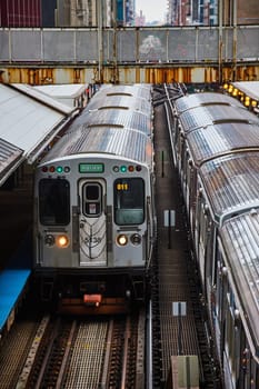 Dynamic Scene of Subway Train 5138 Arriving at Elevated Station in Urban Chicago, Symbolizing City Commute and Transportation in 2023