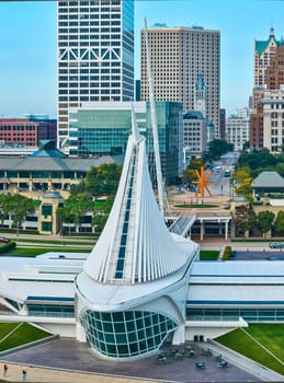 Drone-captured panorama of Milwaukee Art Museum's modernist Quadracci Pavilion against urban skyline, 2023