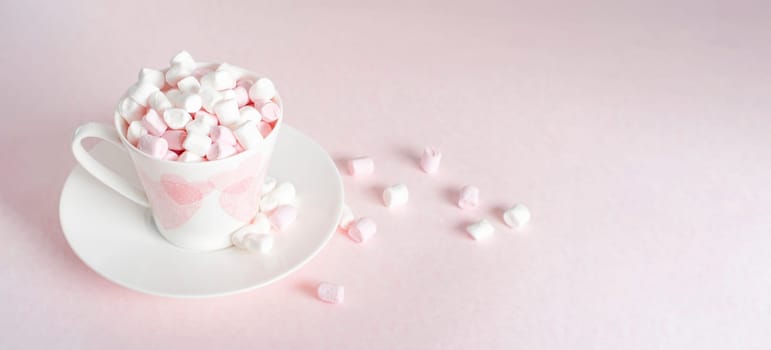 pastel peach still life with mini marshmallows in porcelain cup with pink hearts, gift for Mother's Day, Valentine's Day, trend color 2024, horizontal banner,High quality photo