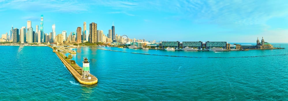 2023 aerial panorama of Chicago skyline featuring John Hancock Center, Navy Pier Ferris wheel, and historic lighthouse on Lake Michigan at golden hour