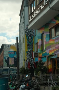 Vertical shot of colorful wall painting and graffiti at the Holzmarkt in Berlin, Germany