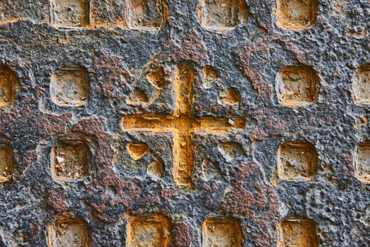 Golden Cross on Weathered Wall, Symbol of Spirituality and Heritage, Indianapolis 2023