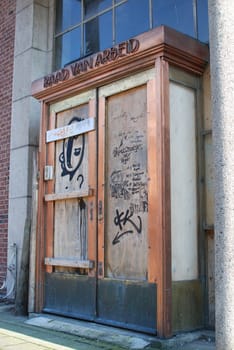 Vertical shot of the abandoned and dilapidated entrance of the Labour Council Raad van Arbeid