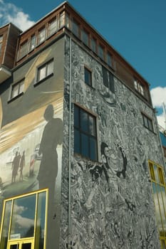 Vertical shot of a colorful wall painting and graffiti at the Holzmarkt in Berlin, Germany