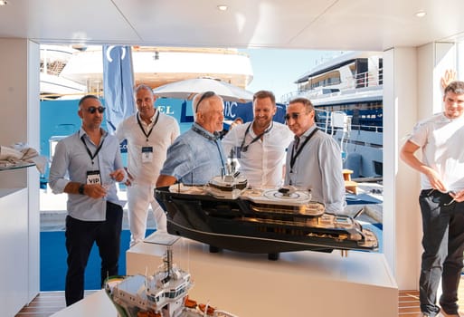 Monaco, Monte Carlo, 28 September 2022 - a lot of people, clients and yacht brokers look at the mega yachts presented, discuss the novelties of the boating industry at the famous motorboat exhibition. High quality photo