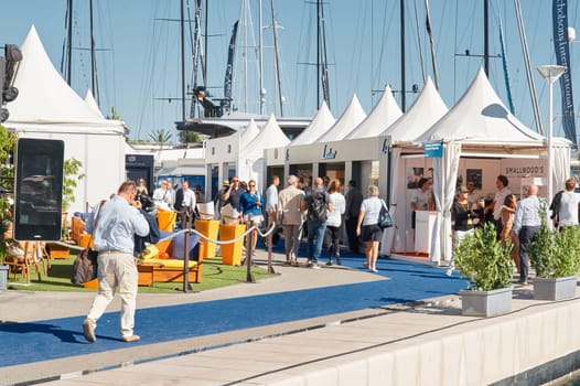 Monaco, Monte Carlo, 28 September 2022 - a lot of people, clients and yacht brokers look at the mega yachts presented, discuss the novelties of the boating industry at the famous motorboat exhibition. High quality photo