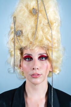 Royal party. Funny princess, queen wearing black jacket, and vintage royal wig with red makeup looking at camera. Concept of comparison of eras, modernity and renaissance, beauty