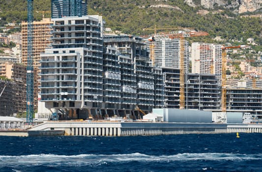 The construction of the island of the new ward of Le Portier taken from Port Hercules, expansion of the territory of the principality, construction of new elite quarter, unique investment project. High quality photo