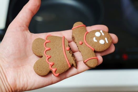 Gingerbread man broken. Traditional New Year and Christmas homemade cookies. Selective focus