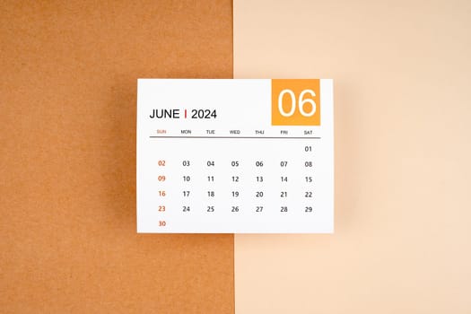 June 2024 calendar page on yellow background.