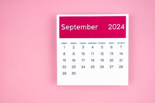 calendar page September 2024 on pink color background.