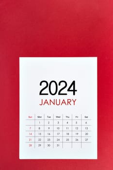 January 2024 calendar page on red background.