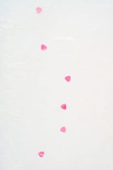 White mulberry paper with red hearts for background