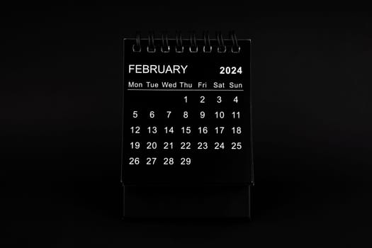 Black Calendar for February 2024. Desktop calendar on a black color background.