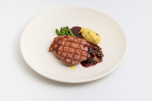 Thinly sliced grilled tenderloin on white background