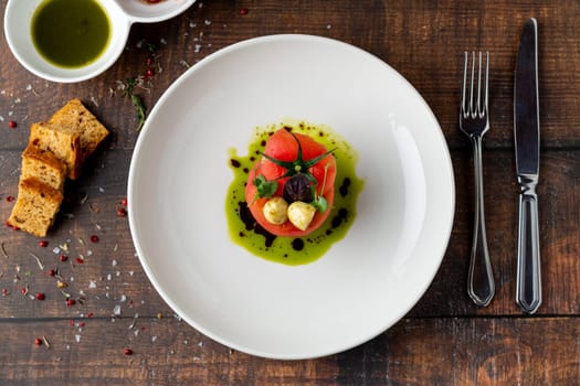 Tomato Caprese salad with mozzarella and micro sprouts