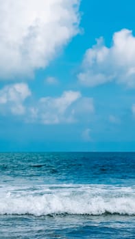 Turquoise clear sea view panorama blue sky white clouds close wave, beauty of nature, skyline. Vertical.