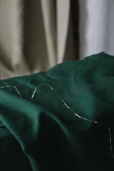 Full frame emerald green linen fabric texture closeup for backdrop