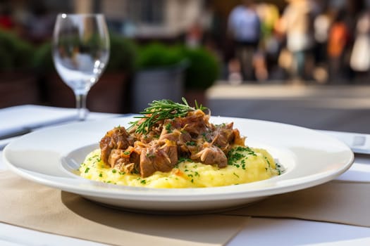 Cassoeula, traditional Lombardy dish with a stew made with pork meat and cabbage, often served with polenta. Italian seasonal comfort dish.