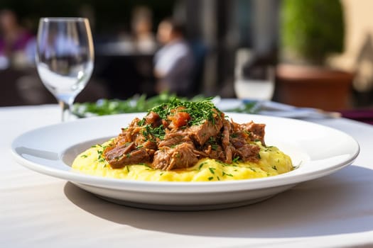 Cassoeula, traditional Lombardy dish with a stew made with pork meat and cabbage, often served with polenta. Italian seasonal comfort dish.