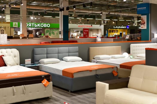 Moscow, Russia - June 09. 2021. Sale of beds with mattresses in Furnituregood store