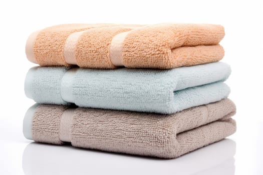 A tide pile of fresh and clean towel, all folded in a bathroom, colorful towels