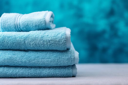 A tide pile of fresh and clean towel, all folded in a bathroom, colorful towels