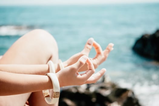 Close up Hand Gesture of Woman Doing an Outdoor Lotus Yoga Position. Close up. Blurred background