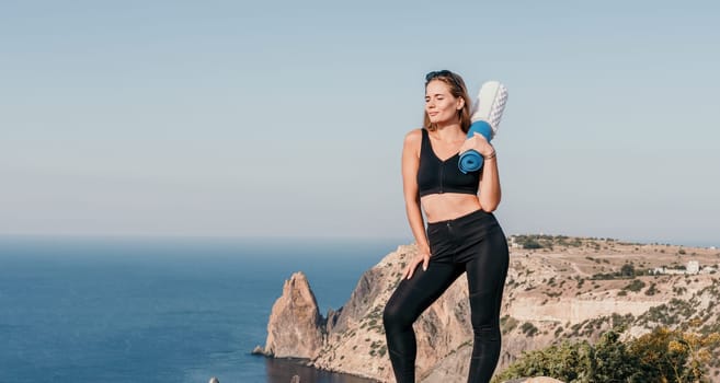 Fitness woman sea. Outdoor workout on yoga mat in park near to ocean beach. Female fitness pilates yoga routine concept. Healthy lifestyle. Happy fit woman exercising with rubber band in park.