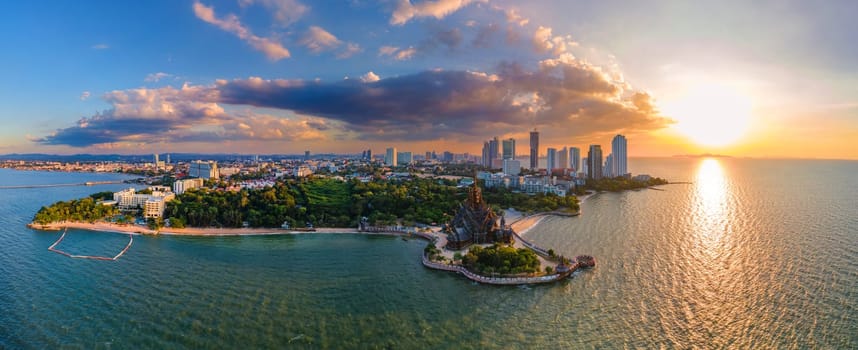 Skyline of Pattaya city with The Sanctuary of Truth wooden temple in Pattaya Thailand