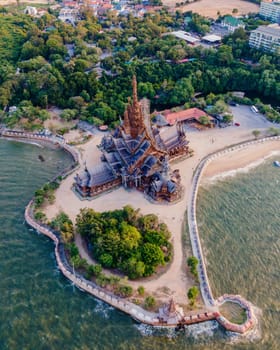 The Sanctuary of Truth wooden temple in Pattaya Thailand is a gigantic wooden construction located at the cape of Naklua Pattaya City Chonburi Thailand in the evening light