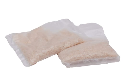 A Plastic Bags of White Long Grain Rice - Isolated on White Background. Small Transparent Packages with Dry Rice - Isolation