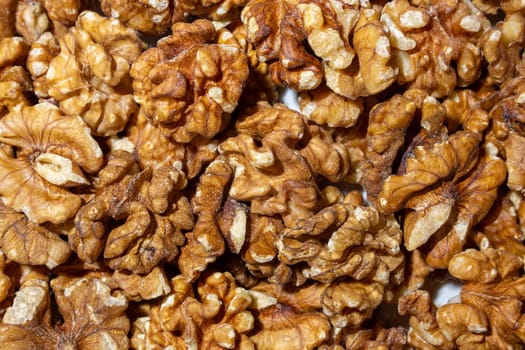 Scattered Shelled Walnuts. Background from Walnut. Natural High-Calorie Snacks