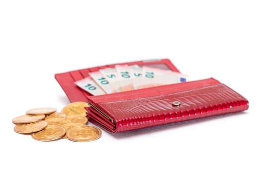 Opened Red Women Purse with 10 Euro Banknotes Inside and Bitcoin Coins - Isolated on White Background. A Wallet Full of Money Symbolizing Wealth, Success, Shopping and Social Status - Isolation