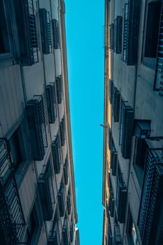 Historical building on Rambla street cityscape image. Aerial street view at sunset time in Barcelona, Spain photo. Beautiful urban scenery photography. Street scene. High quality picture for wallpaper, article