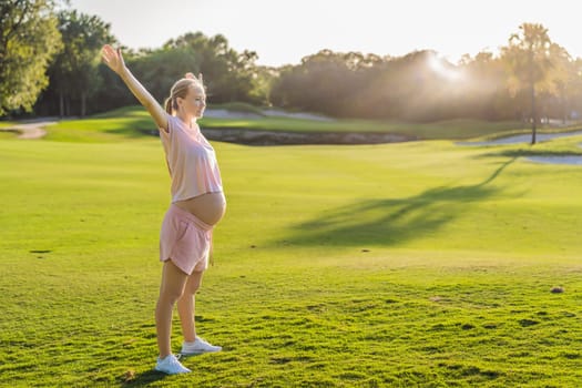 Energetic pregnant woman takes her workout outdoors, using an exercise mat for a refreshing and health-conscious outdoor exercise session.