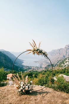 Round wedding arch stands on a mountain above the Bay of Kotor. Montenegro. High quality photo