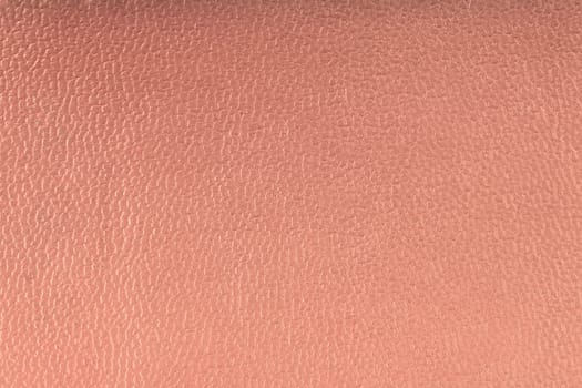 Pink leather texture closeup detailed background.