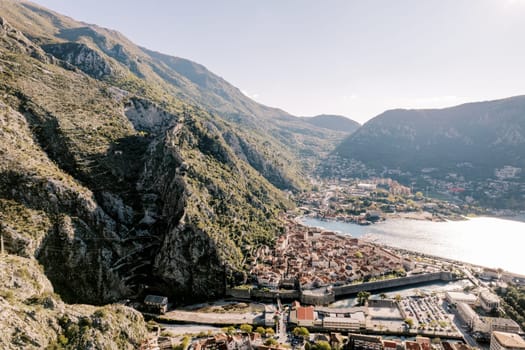 Ancient stone fortress walls of the resort town above the canal. Kotor, Montenegro. High quality photo