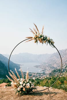 View through the round wedding arch standing on the mountain to the Bay of Kotor. Montenegro. High quality photo