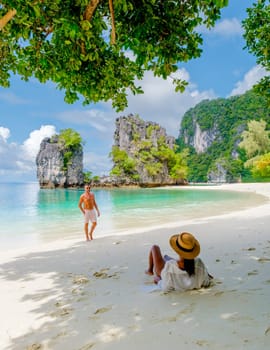 Koh Hong Island Krabi Thailand, a couple of men and women on the beach of Koh Hong, a tropical white beach with Asian women and European men in Krabi Thailand