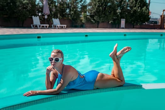 Bikini-clad woman enjoys poolside relaxation. Poolside ambiance. Capturing woman's relaxed time near pool