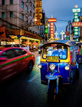 Bangkok Thailand 10 July 2022, traffic rush hour in the city at dusk evening, Bangkok cityscape traffic with a colorful tuk tuk in the city China Town with neon lights