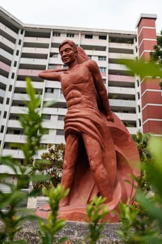 Red Human Statue with Fish in Urban Apartment