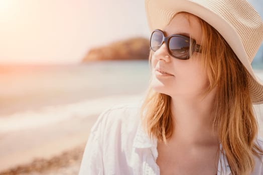 Young woman in red bikini on Beach. Blonde in sunglasses on pebble beach enjoying sun. Happy lady in one piece red swimsuit relaxing and sunbathing by turquoise sea ocean on hot summer day. Close up,