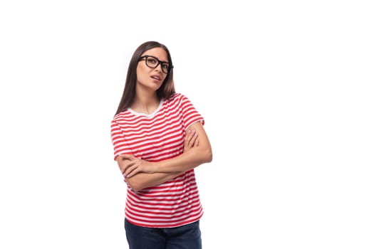 portrait of a young well-groomed european woman with straight black hair in glasses on a white background with copy space.